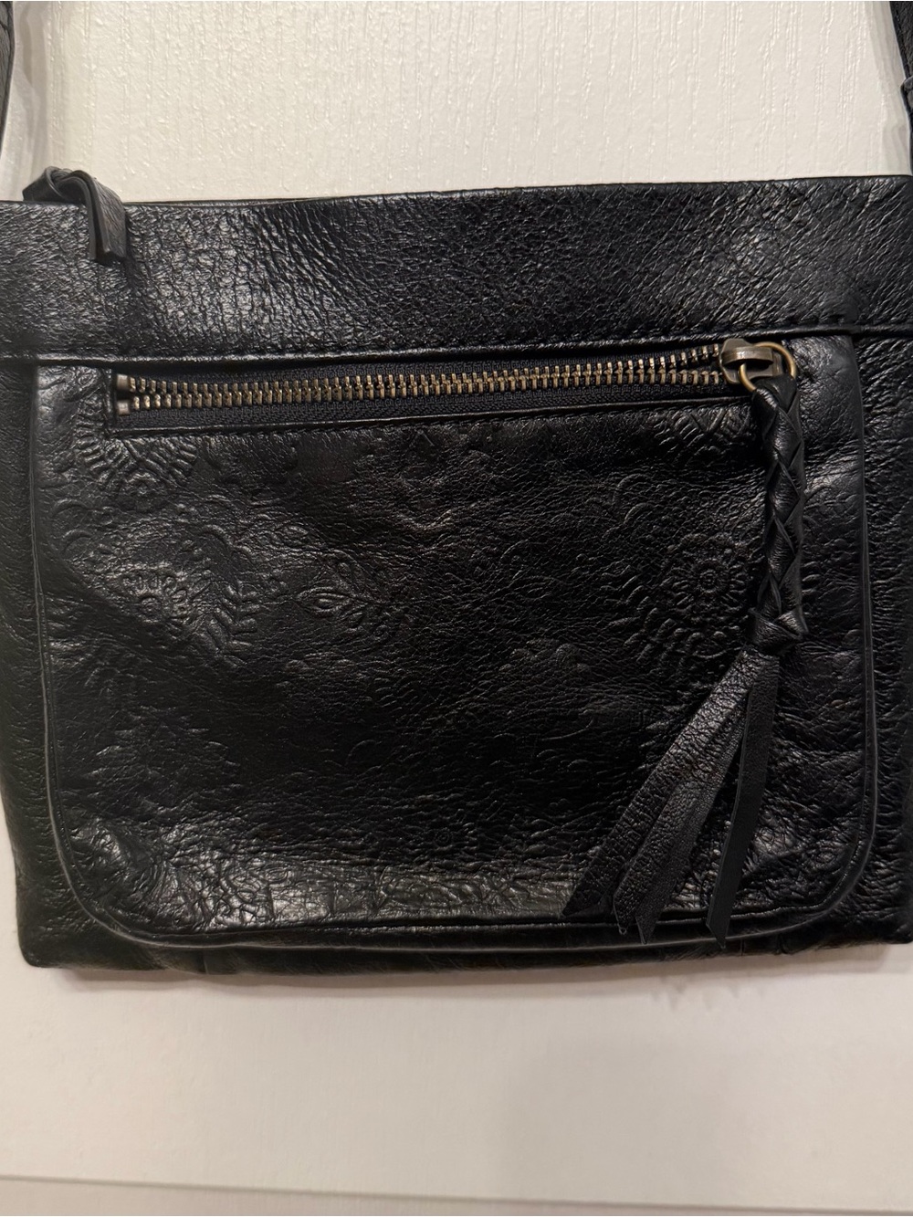The Sak Black Embossed Leather Crossbody Bag with Tassel